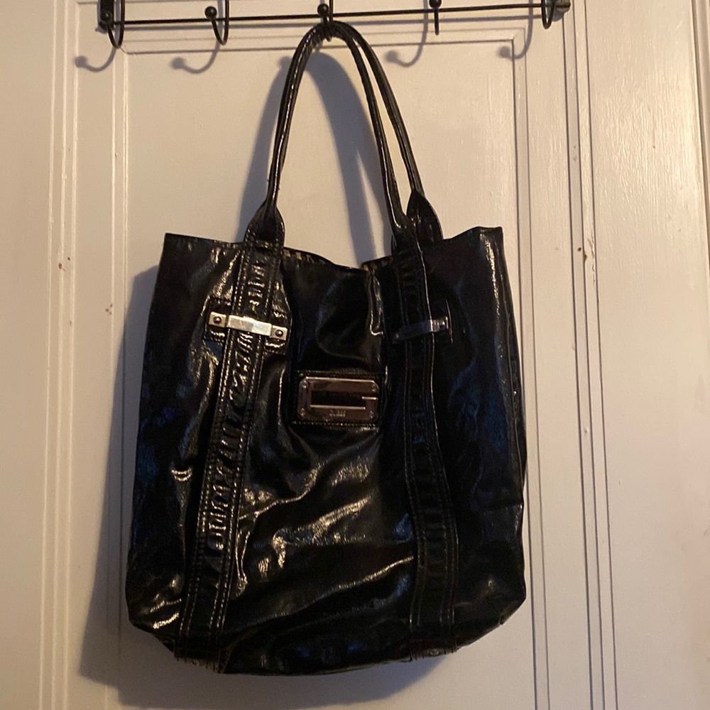 Black patent leather Guess bag.